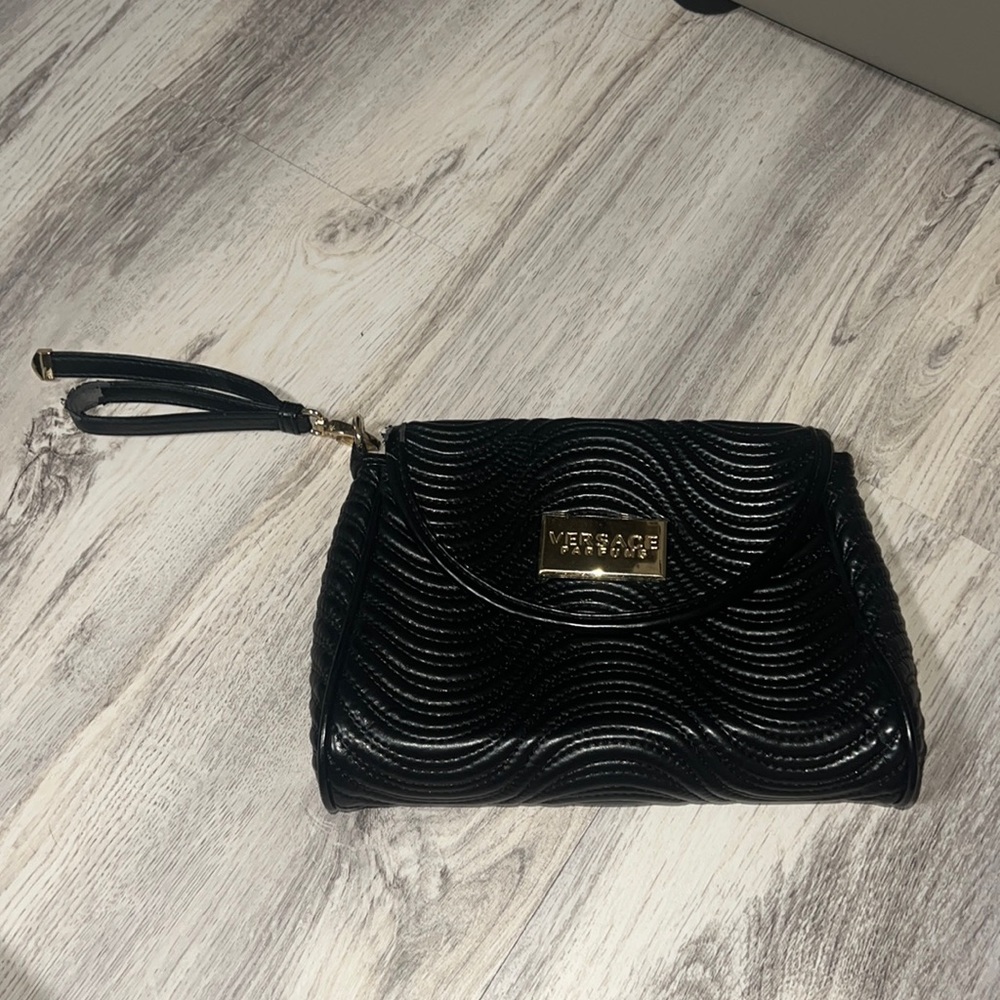 Used Versace perfume clutch